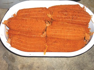 Seasoned and netted prepared loin ready for hanging